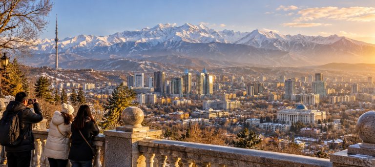 Almaty Kazakhstan city and snow-capped Tian Shan mountains seen from the Kok Tobe pedestrian viewing terrace